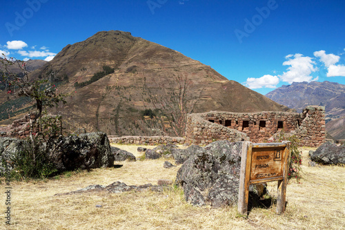 complex of well-preserved ruins in Pisac with a plaque stating its name written "P'isaqa Sector" and the altitude of the site