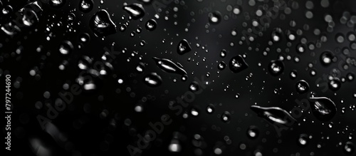 Abstract raindrops on black background