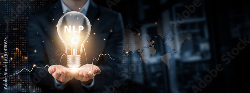 NLP: Insight Concept. Hands of businessman holding light bulb and NLP (Natural Language Processing) with data network digital technology. Advancing Communication, Analyzing Textual Data.