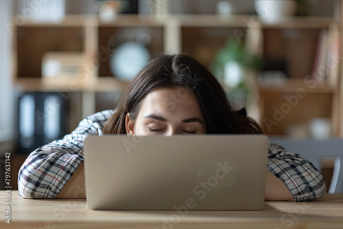 Bored tired office worker falling asleep on laptop, person tired after long working hours, exhausted because of increased workload. Concept of overwork, stress, boredom, no motivation, lack of sleep 