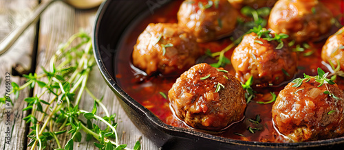 Meatballs in tomato sauce in a frying pan 