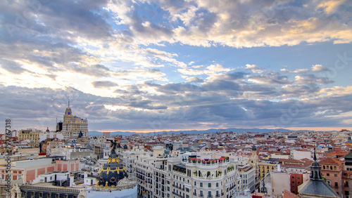 Panoramic aerial view of Gran Via timelapse before sunset, Skyline Old Town Cityscape, Metropolis Building, capital of Spain