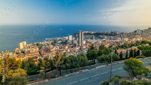 Cityscape timelapse of Monte Carlo, Monaco with roofs of buildings during summer sunset.