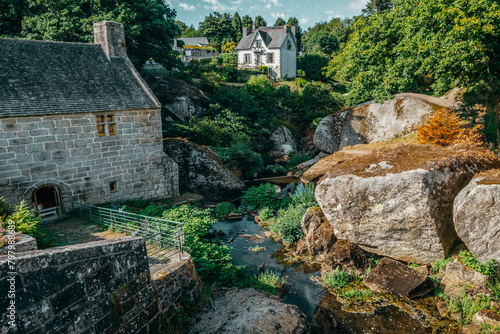 Rock formations in the forest, Watermill. The Chaos of the Huelgoat forest. cradle of numerous Celtic legends. Finistère, Brittany, France.