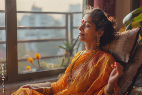 Serene Woman in Traditional Saree Enjoying a Lazy Afternoon