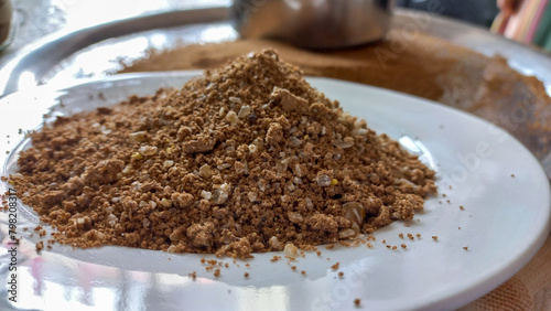 Ground carob pieces with their seeds