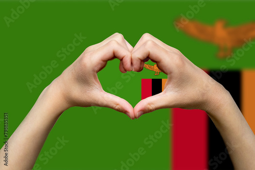 Zambia flag with two hands heart shape, support or donate to Zambia, patriotism and nationalism 