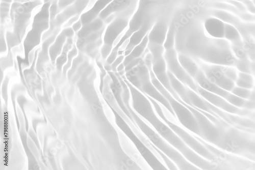 White Water with Ripples, white watery background with a dark natural surface and a unique watery texture, top view of sea waves, a white watery background characterized by texture and wrinkles 