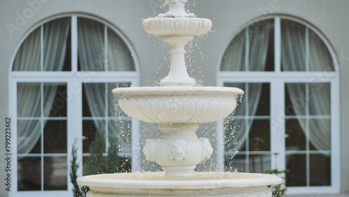 White architectural fountain on the estate.