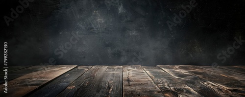 dark wooden table with an empty middle for displaying products, and a dark backdrop