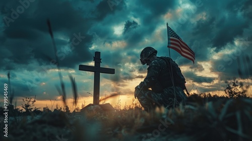 a silhouette of a soldier kneeling beside a battlefield cross, with the American flag draped over it, serving as a poignant tribute to fallen heroes.