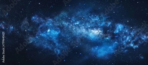 Vibrant blue galaxy featuring twinkling stars set on a deep black background resembling a night sky