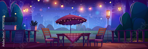 Night street cafe or restaurant in city park scene background. Outdoor patio with table, garland, umbrella and chair in evening for romantic date or celebration. Urban summer terrace with signboard