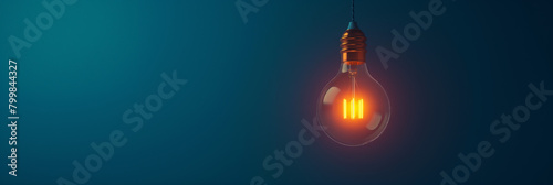 A minimalistic image of a light bulb with a striking filament design emits a radiant orange glow