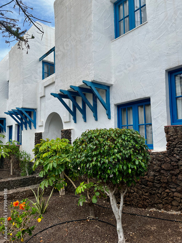 White house on the Canary Islands with blue windows. Vacation accommodation in Costa Adeje