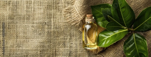 camphor essential oil on burlap background. selective focus