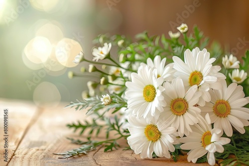 An elegant wedding centerpiece featuring white daisies and green foliage, set on a rustic wooden table under warm, ambient lighting