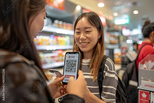 Image of a customer scanning a QR code with their phone, easy transaction and smiling cashier in the background