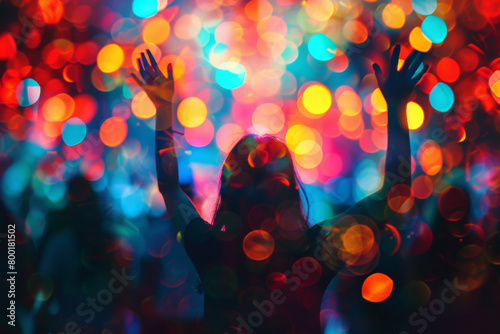 Woman dancing silhouette with colorful bokeh vibrant blur