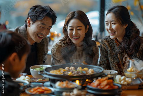 A sophisticated Korean family gathering in a luxurious villa or apartment's elegant kitchen, hosting three guest families around a large dining table.