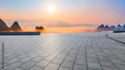Empty square floor and beautiful mountain with sky clouds at sunrise
