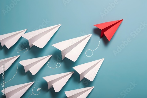 Innovative white paper airplanes on blue background, with red outlier, represent uniqueness and new perspectives