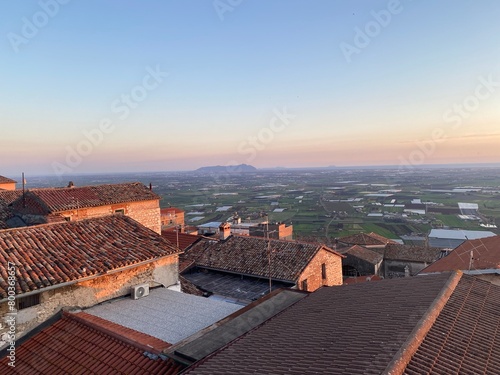 Rooftops and the Mediterranean Sea. Sezze, Italy. April 2023 