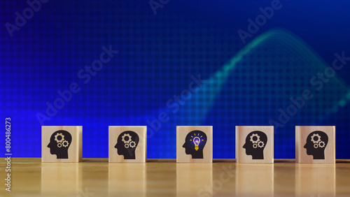 Thinking skills for business leader and manager concept. creative, systematic thinking skill, wooden cube block with head human symbol and light bulb icon creative idea concept.