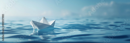 A serene paper origami boat floats on calm blue water, symbolizing tranquility, simplicity and imagination
