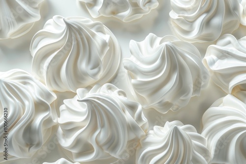 A close up of white meringue on a table, perfect for food blogs or bakery advertisements
