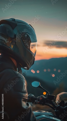 A side profile close-up of a lone rider on a motorcycle, captured at night under the ambient glow of streetlights