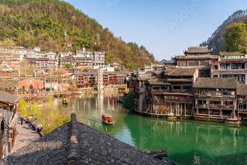 Feng Huang Ancient Town (Phoenix Ancient Town) and tourist boats on Tuo Jiang River, The famous tourist destination at Hunan Province, China