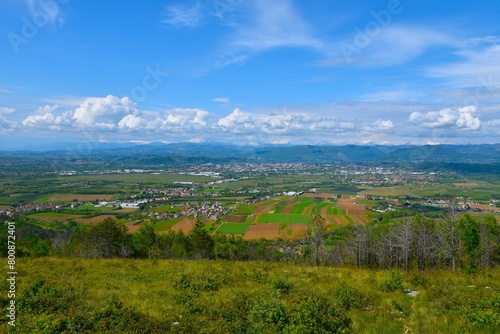 View of towns of Goricia and Nova Gorica at Slovenia and Italy border with mountains in the background