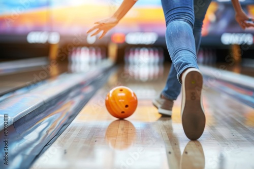 Dynamic bowling moment bowler strikes with precision in energetic alley atmosphere