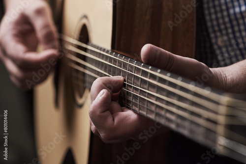 Hands, home and man with guitar, talent and instrument with strings, performance and musician. Learning, closeup and person with audio, production sound or worship with creativity and solo artist