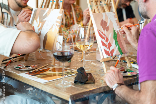 Painting and sip workshop. People enjoying art and wine.