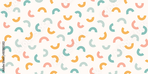 Abstract arch shapes pastel seamless pattern. Scattered small shapes rainbow squiggle pastel gender neutral background.