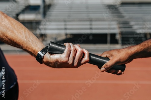 Team mates passing a relay baton