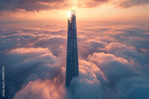 Lone tall skyscraper over the clouds at sunrise, beautiful view