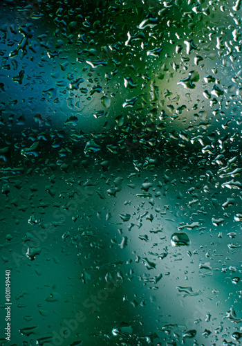 water drops on glass the melancholy mood of a rainy day. with raindrops on a window abstract 