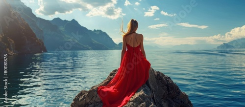 Woman model in a beautiful red dress is looking at the sea panorama AI generated image