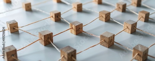 A network diagram crafted from wooden blocks, each connection point labeled with stakeholders involved in AI ethics (developers, users, regulators), highlighting the interconnected responsibilities