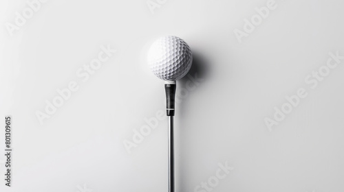 Isolated golf ball and club, with person balancing on club. White background.