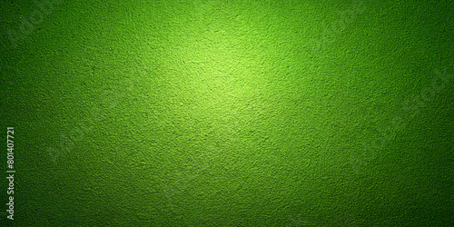 The bright green textured surface is illuminated from above, casting subtle light and shadows on its rough features. The light source creates a bright spot in the centre which gradually fades.AI gener