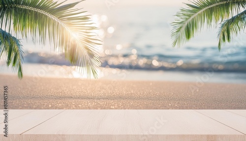 blur beautiful nature green palm leaf on a tropical beach with bokeh sun light abstract texture background