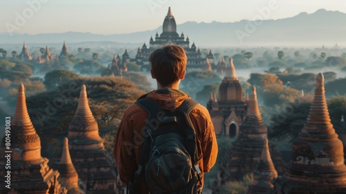A solo tourist admiring ancient temples at sunrise in Bagan, Myanmar