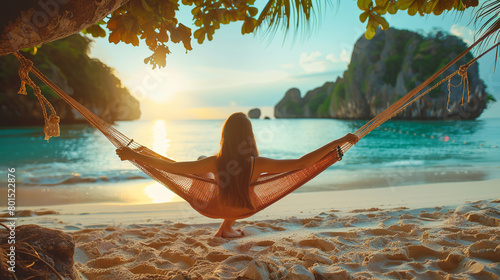 Behind Traveler woman relax in hammock on summer beach