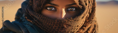 Mysterious eyes of a woman in desert