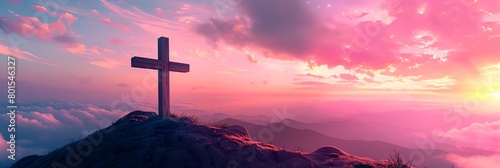 a cross on a hill with a sunset in the background and clouds in the sky above it