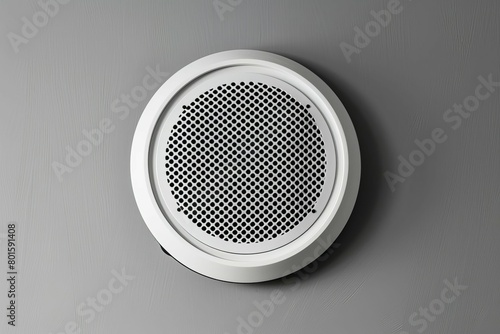 minimalist white round ceiling speaker with perforated grille isolated product shot